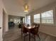 Dining room features wood floors and seating for four at 404 Elder St # 230, Englewood, FL 34223