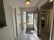 Inviting entryway with tiled flooring, storm door and ample natural light at 404 Elder St # 230, Englewood, FL 34223