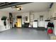 Spacious garage with laundry, water heater, epoxy flooring, and ample storage at 404 Elder St # 230, Englewood, FL 34223