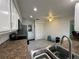 Kitchen featuring stainless appliances, granite countertops, and bright lighting at 404 Elder St # 230, Englewood, FL 34223