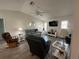 Cozy living room featuring wood floors, ceiling fan, and a vaulted ceiling at 404 Elder St # 230, Englewood, FL 34223