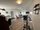 Spacious living room with wood floors, ceiling fan, and plenty of room to relax at 404 Elder St # 230, Englewood, FL 34223