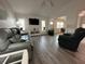 Open living room features wood floors, neutral paint, and ample natural light at 404 Elder St # 230, Englewood, FL 34223