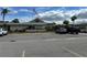 Spacious parking lot with multiple cars in front of the building at 404 Elder St # 230, Englewood, FL 34223