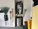 Garage storage with water heater, AC, and organizers at 404 Elder St # 230, Englewood, FL 34223