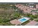 Aerial view of a community pool and recreation area, surrounded by lush greenery and residential buildings at 4206 Vicenza Dr # A24, Venice, FL 34293