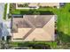 Aerial view of the home showcasing the roof and surrounding landscaping at 4301 Whispering Oaks Dr, North Port, FL 34287