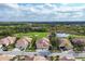 Beautiful golf course community with ponds and nature preserves, as seen from an aerial view at 4301 Whispering Oaks Dr, North Port, FL 34287