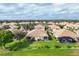 Aerial view of a residential community with well-maintained yards and landscaping at 4301 Whispering Oaks Dr, North Port, FL 34287