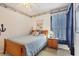 Cozy bedroom featuring a bed, nautical decor, and a window with natural light at 4301 Whispering Oaks Dr, North Port, FL 34287
