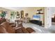 Spacious living room featuring plush seating, a television, and neutral-colored carpet at 4301 Whispering Oaks Dr, North Port, FL 34287