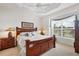 Bright primary bedroom with a decorative ceiling, large window, and comfortable furnishings at 4301 Whispering Oaks Dr, North Port, FL 34287