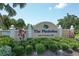 Entrance sign to The Plantation Golf & Country Club surrounded by manicured landscaping at 454 Cerromar Rd # 174, Venice, FL 34293