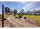 Scenic view of the condo complex nestled along a golf course, showcasing community landscaping at 454 Cerromar Rd # 174, Venice, FL 34293