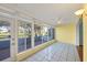 Relaxing sunroom featuring tiled flooring, bright paint, and beautiful backyard views at 454 Cerromar Rd # 174, Venice, FL 34293