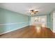 Spacious living room with light-blue walls, wood floors, and open concept design at 454 Cerromar Rd # 174, Venice, FL 34293