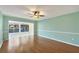 Bright and airy living room featuring wood floors and large windows at 454 Cerromar Rd # 174, Venice, FL 34293