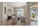 Dining room with modern chandelier and shuttered windows at 5106 Pine Shadow Ln, North Port, FL 34287