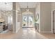 Elegant foyer with decorative front doors and dining area view at 5106 Pine Shadow Ln, North Port, FL 34287