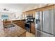 Kitchen with granite countertops, stainless steel appliances, and wood cabinets at 5106 Pine Shadow Ln, North Port, FL 34287