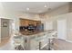 Kitchen with granite countertops, bar seating, stainless steel appliances, and ample cabinet space at 5106 Pine Shadow Ln, North Port, FL 34287