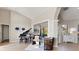 Living room with piano and comfortable seating arrangement at 5106 Pine Shadow Ln, North Port, FL 34287