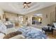 Open-concept living room with high ceilings, bar seating, and view to the outdoor patio through large window at 5106 Pine Shadow Ln, North Port, FL 34287