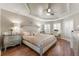 Spacious main bedroom features tray ceilings, wood floors, and plantation shutters at 5106 Pine Shadow Ln, North Port, FL 34287