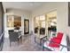 Relaxing screened-in patio with brick flooring and access to interior at 5106 Pine Shadow Ln, North Port, FL 34287