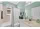 Light and airy bathroom with a shower-tub combo and a large window at 5109 Pine Shadow Ln, North Port, FL 34287