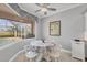 Bright breakfast nook with a view of the pool and golf course at 5109 Pine Shadow Ln, North Port, FL 34287