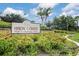 Attractive Heron Creek Golf & Country Club sign amidst landscaped flower beds at 5109 Pine Shadow Ln, North Port, FL 34287