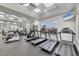 Modern fitness center with treadmills and other machines, offering a variety of workout options at 5109 Pine Shadow Ln, North Port, FL 34287