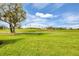 Expansive view of the lush green golf course, showcasing the property's desirable location at 5109 Pine Shadow Ln, North Port, FL 34287