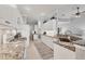 Well-lit kitchen boasting granite countertops, stainless steel appliances, and ample cabinet space at 5109 Pine Shadow Ln, North Port, FL 34287
