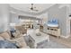 Bright living room with neutral tones, stylish furniture, and scenic view of the outdoor patio at 5109 Pine Shadow Ln, North Port, FL 34287