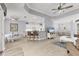 Expansive living area with views of the kitchen and dining spaces, perfect for entertaining at 5109 Pine Shadow Ln, North Port, FL 34287