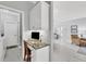 Home office space with a built-in desk, cabinetry, and bright lighting at 5109 Pine Shadow Ln, North Port, FL 34287