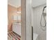 Bathroom showcasing a walk-in shower with tiled walls and a built-in seat at 5109 Pine Shadow Ln, North Port, FL 34287