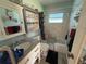 Bright bathroom with accessible features, a shower-tub combo and modern vanity at 519 Bellaire Dr, Venice, FL 34293