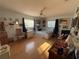 Cozy bedroom with ample natural light, ceiling fan, and framed artwork on the walls at 519 Bellaire Dr, Venice, FL 34293