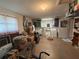 Spacious garage with washer, dryer, shelving, and a utility sink offers ample storage and functionality at 519 Bellaire Dr, Venice, FL 34293