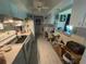 Well-equipped kitchen featuring modern appliances, white cabinetry, and a functional layout at 519 Bellaire Dr, Venice, FL 34293