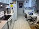 Traditional style kitchen with white appliances and tile floor needs TLC at 519 Bellaire Dr, Venice, FL 34293
