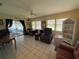 Bright living room featuring tile floors, neutral walls, and several windows providing lots of natural light at 519 Bellaire Dr, Venice, FL 34293