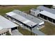 Overhead shot of a neat home with carports and organized surroundings at 5314 Palena Blvd, North Port, FL 34287