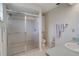 A functional bathroom with a sliding glass door shower, sink, and toilet at 5875 Jackson, Venice, FL 34293