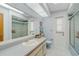 Fresh bathroom featuring a large mirror and a walk-in shower at 5875 Jackson, Venice, FL 34293