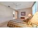 Comfortable bedroom featuring warm tones, a ceiling fan, and access to an adjoining room at 5875 Jackson, Venice, FL 34293