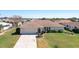 Lovely single story home with well-maintained lawn, colorful landscaping and attached two car garage at 5875 Jackson, Venice, FL 34293